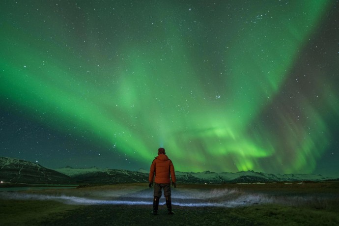 Man watching the northern lights